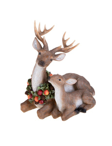 Renna decorativa con cucciolo e ghirlanda autunnale